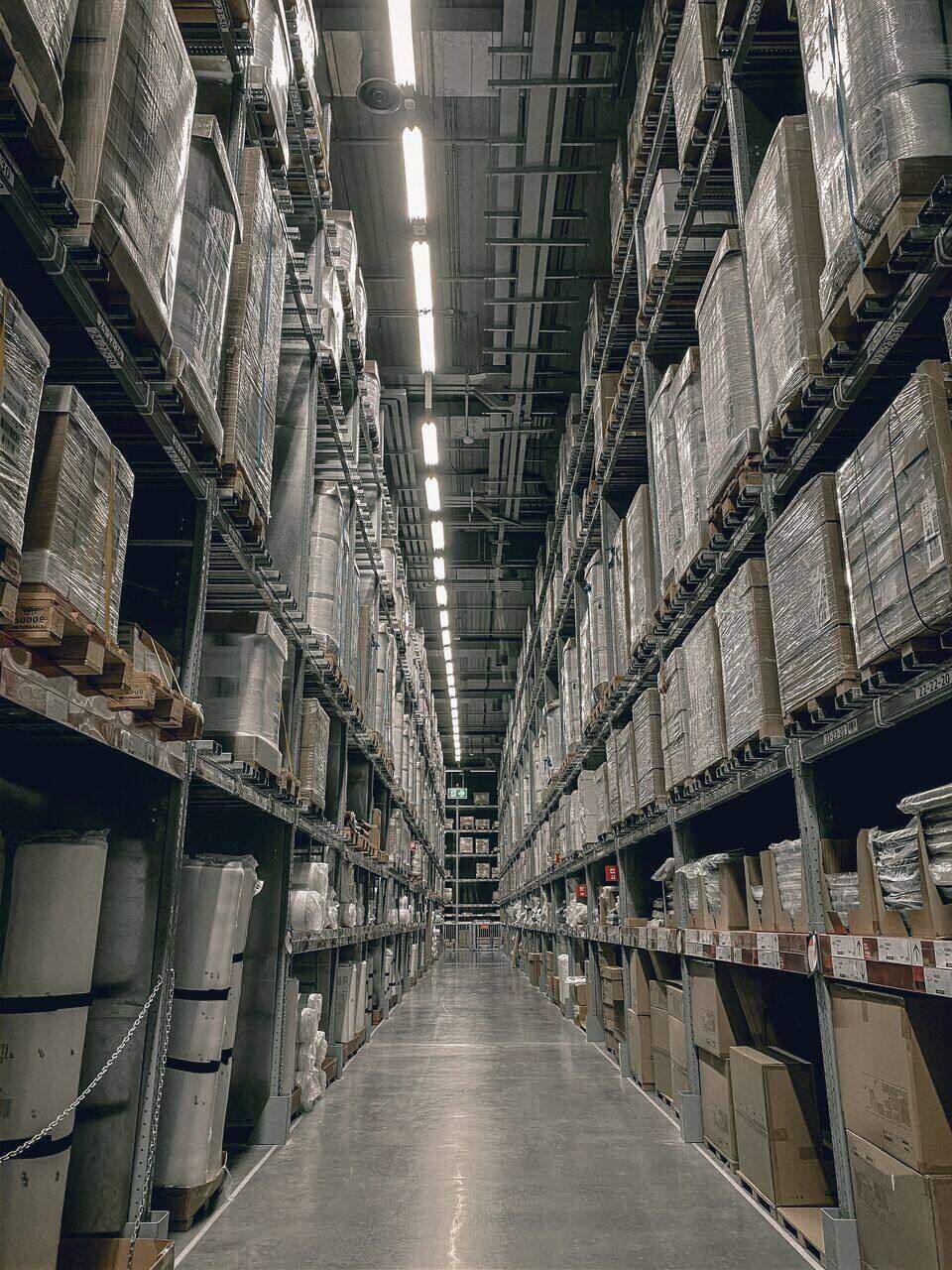 One-point-perspective view down a racked aisle