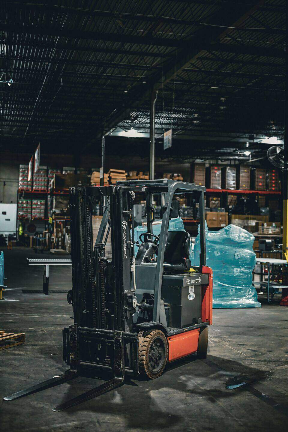 Forklift parked in a dark warehouse