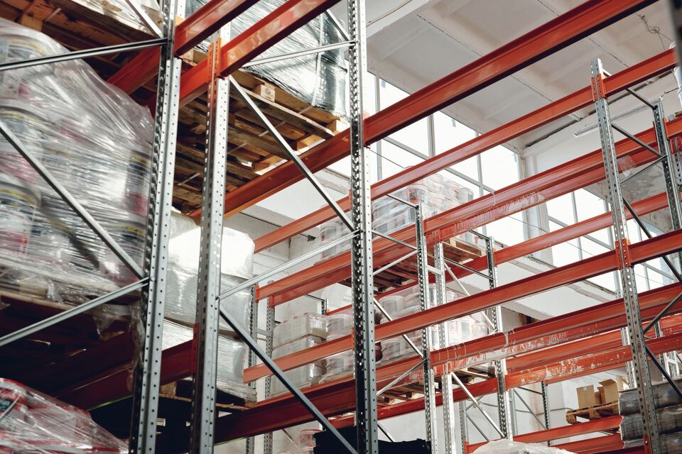Shrink-wrapped pallets staged in a warehouse