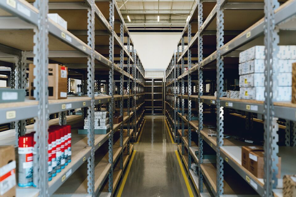 Gritty warehouse walkway between racking