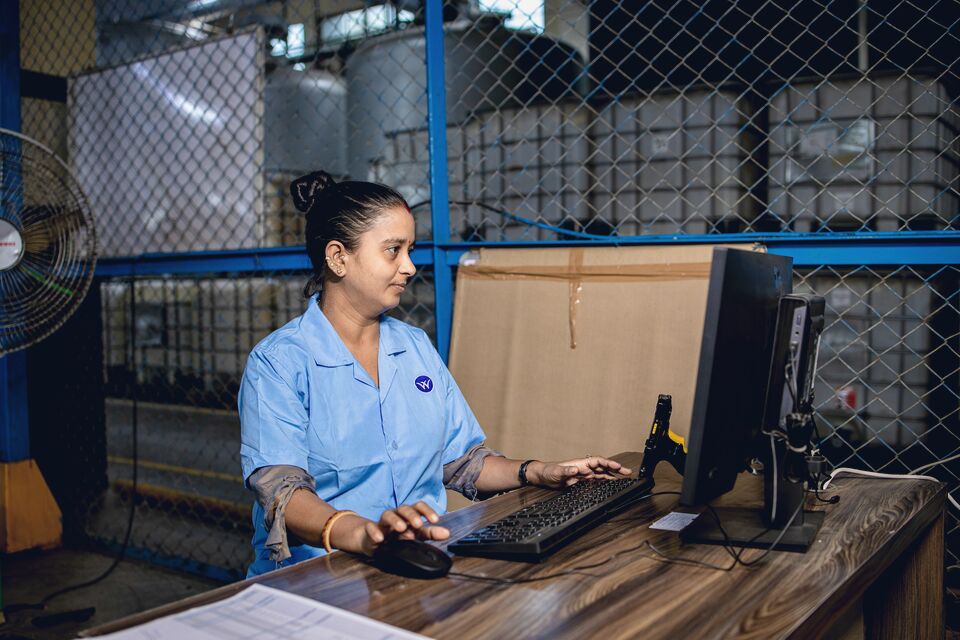 Computer workstation in a dark warehouse office